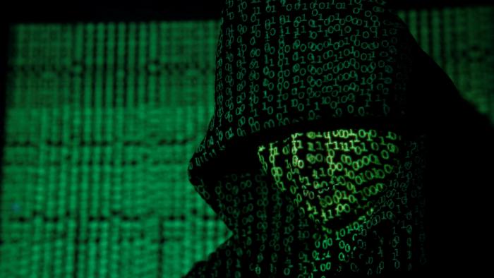 A projection of cyber code on a hooded man is pictured in this illustration picture taken on May 13,  2017. Capitalizing on spying tools believed to have been developed by the U.S. National Security Agency, hackers staged a cyber assault with a self-spreading malware that has infected tens of thousands of computers in nearly 100 countries. REUTERS/Kacper Pempel/Illustration     TPX IMAGES OF THE DAY
