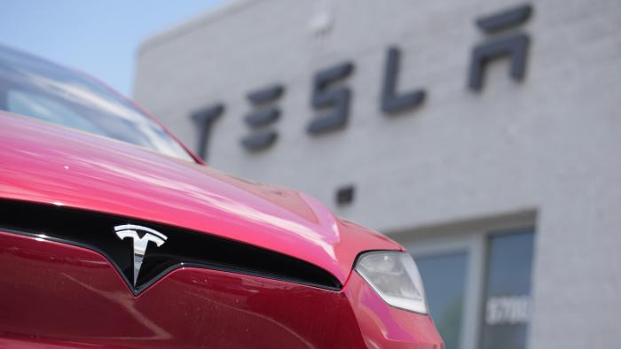 FILE - A Model X sports-utility vehicle sits outside a Tesla store in Littleton, Colo., June 18, 2023. (AP Photo/David Zalubowski, File)