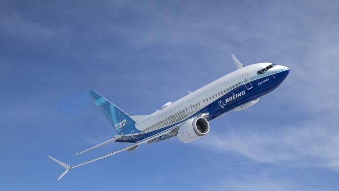 A plane against the blue sky.