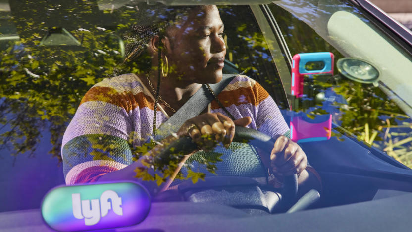 A person sitting in the driver seat of a car.